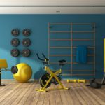 Blue home gym with black and yellow fitness equipment