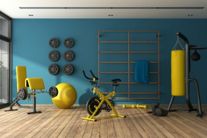 Blue home gym with black and yellow fitness equipment