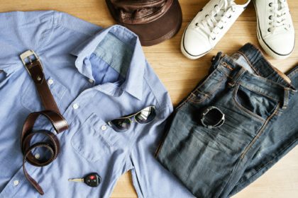 Flat lay of men casual fashion outfits on wooden background